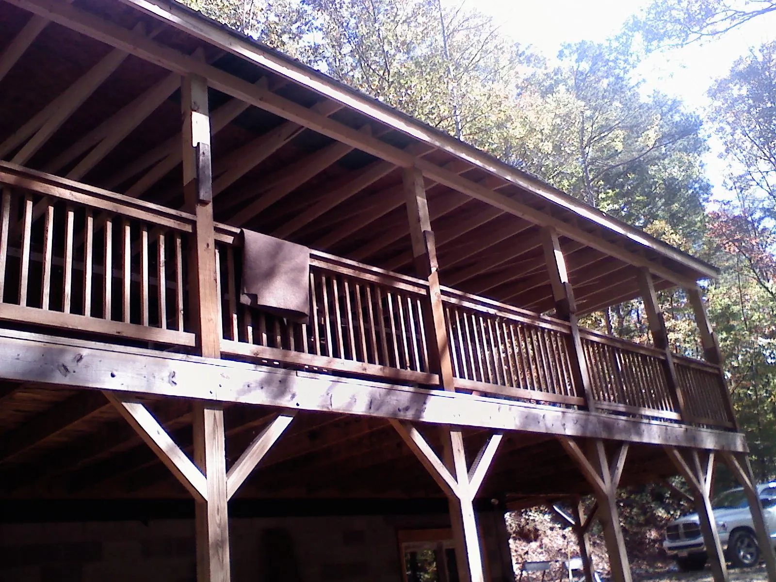 Timber framing under a new elevated porch and deck — Roof Leak Repair in Columbiaville by Roofing Brothers